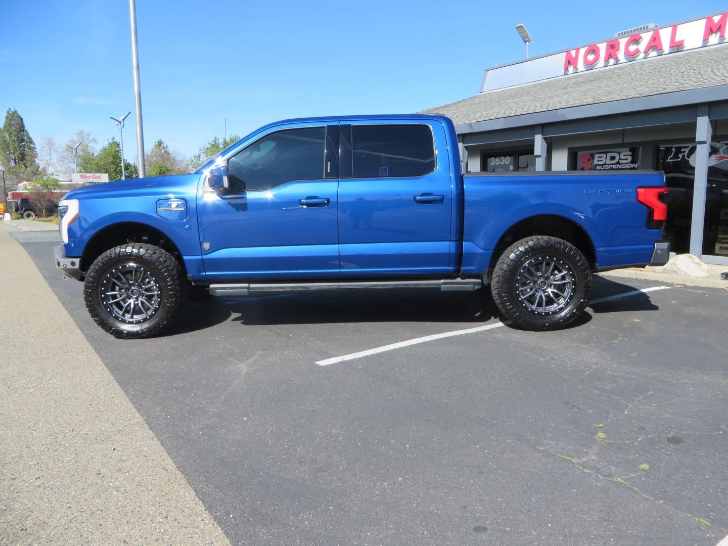 2022 BLUE /BLACK Ford F-150 Lariat Crew Cab 4WD (1FT6W1EV6NW) , located at 2630 Grass Valley Highway, Auburn, CA, 95603, (530) 508-5100, 38.937893, -121.095482 - Tired of gas prices and still want to look cool? Check out this Ford Lightning featuring a RC level kit, Nitto Ridge Grappler tires, Fuel Rebel wheels, Sinister front and rear bumpers, Baja Designs leds, Rigid Industries Leds, Bakflip F1, and window tint. - Photo#7